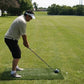 man outdoors hitting a golf ball off of the Big Moss High Impact Golf Mat